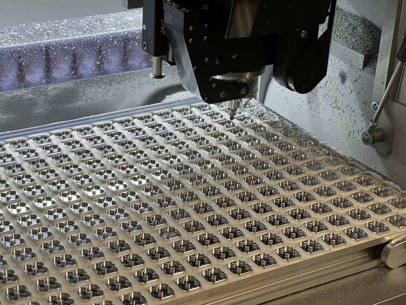 Milled parts on the CNC bed